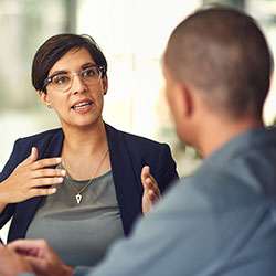 business-mentorship-250x Stock Photo of a Smart-Looking Woman Explaining Something to One of Her Teammates